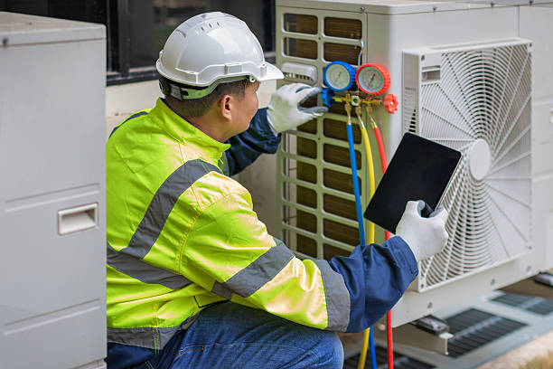 Professional Ductwork Repair technician working in Sand Lake, MI